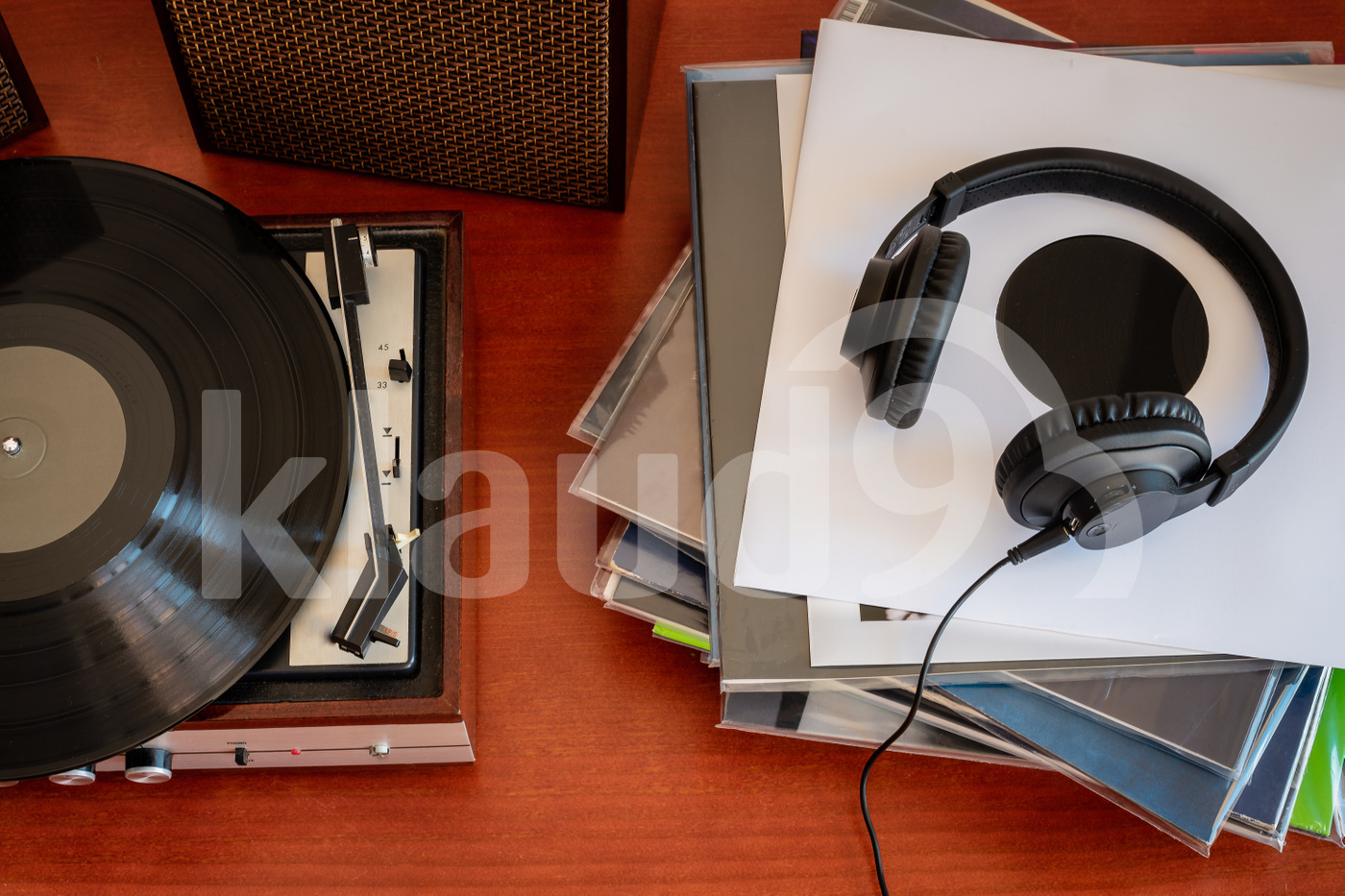 Vintage turntable with vinyls and headphones