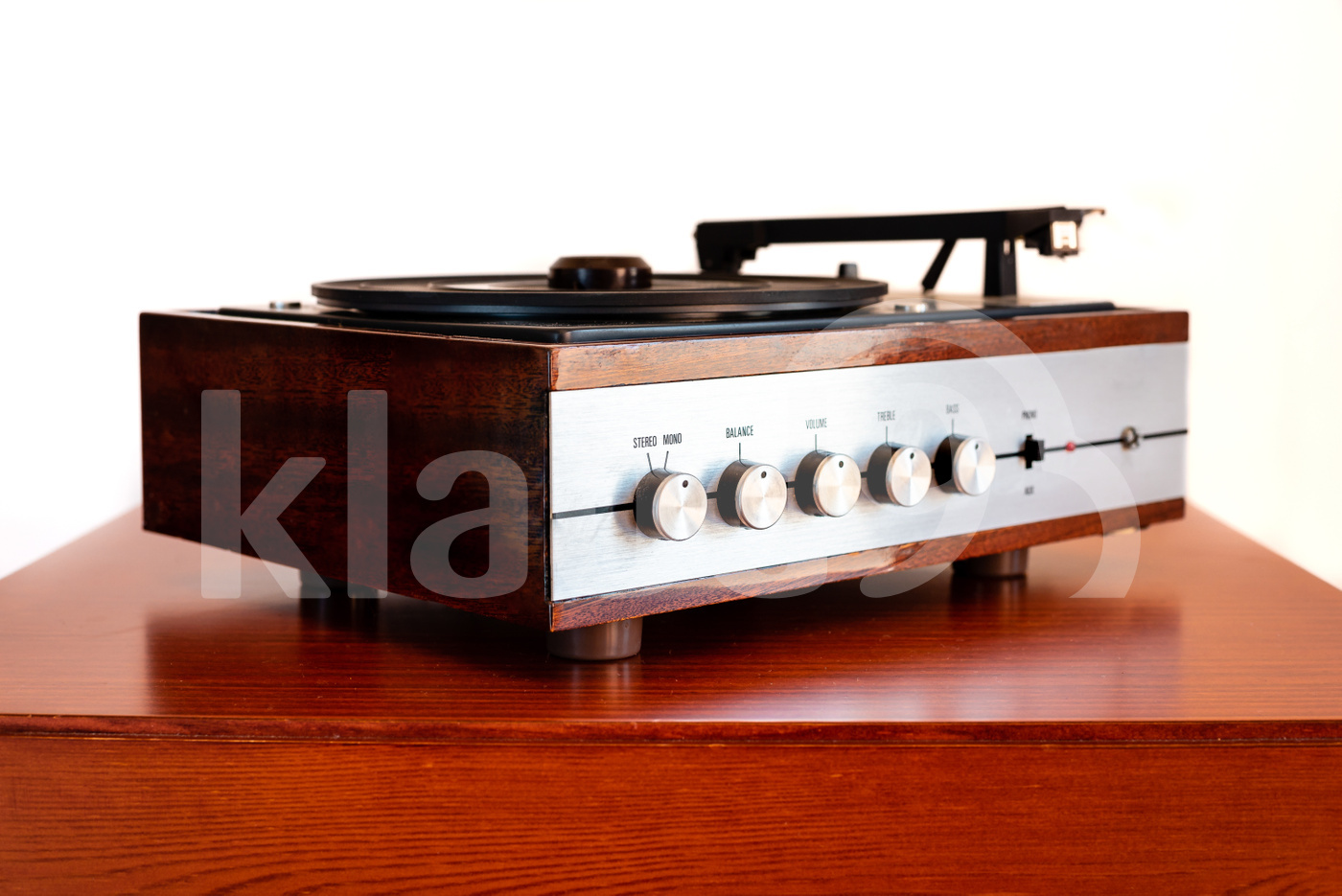 Vintage turntable made of wood on a old table