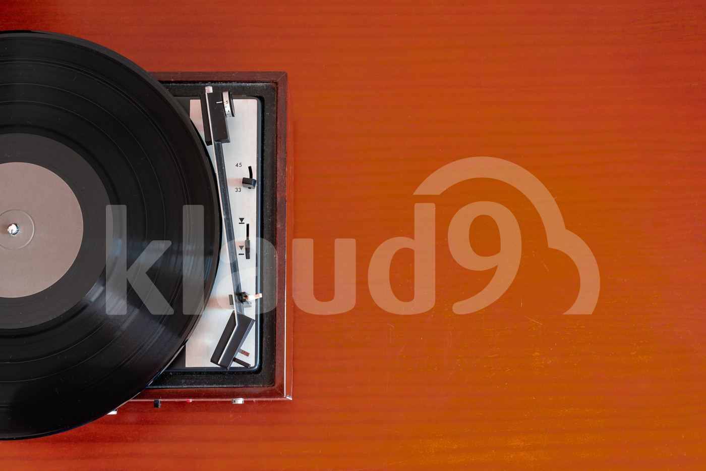 Vintage turntable made of wood on a old table