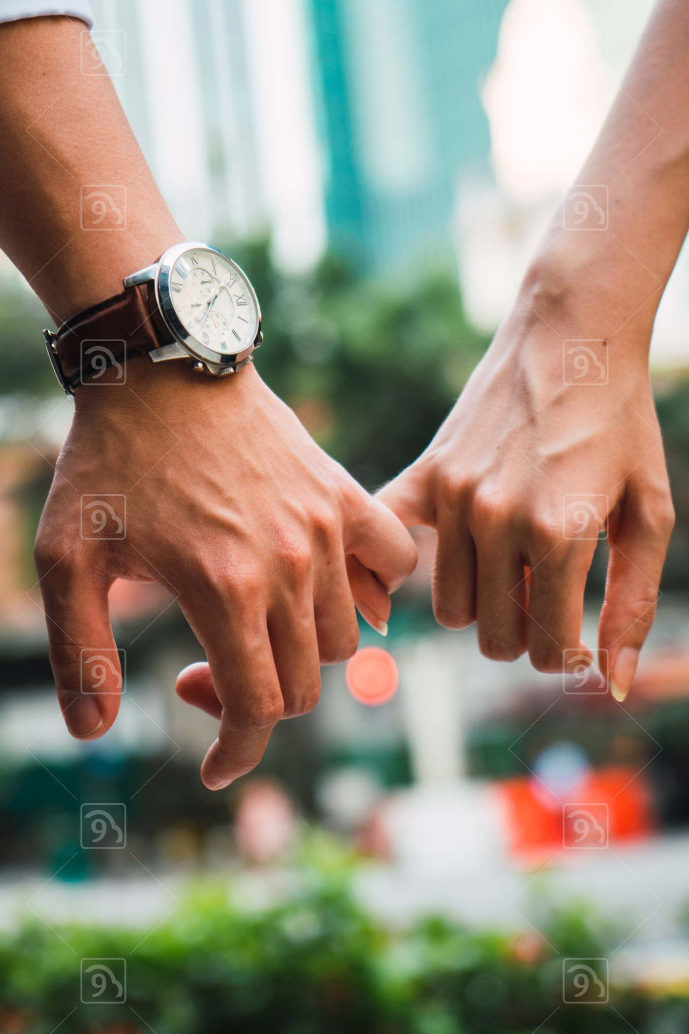 Asian couple holding hands 