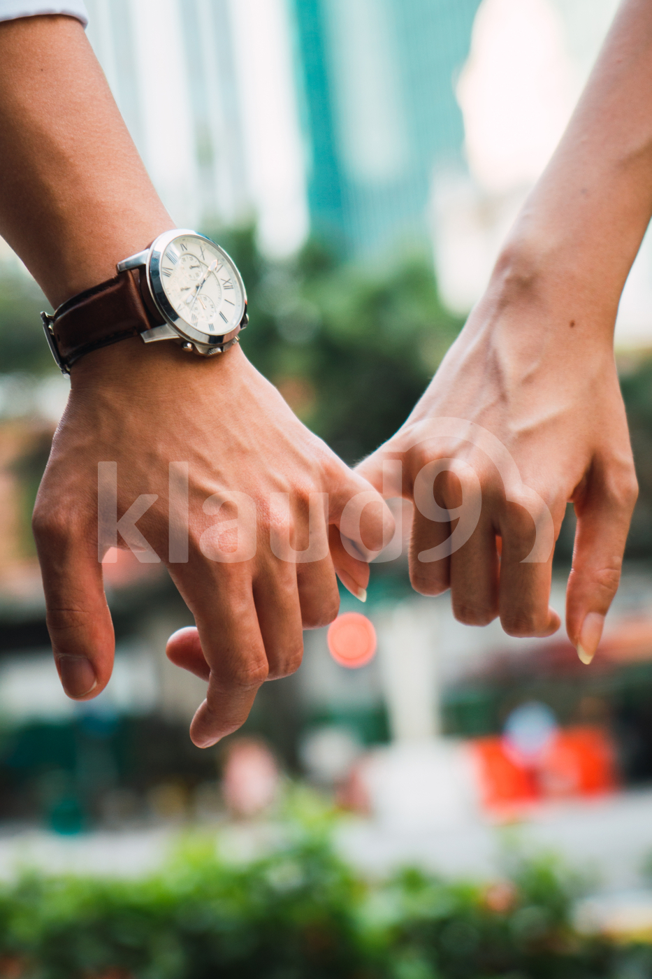 Asian couple holding hands