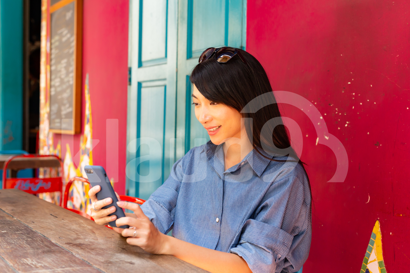 Asian woman looking at mobile