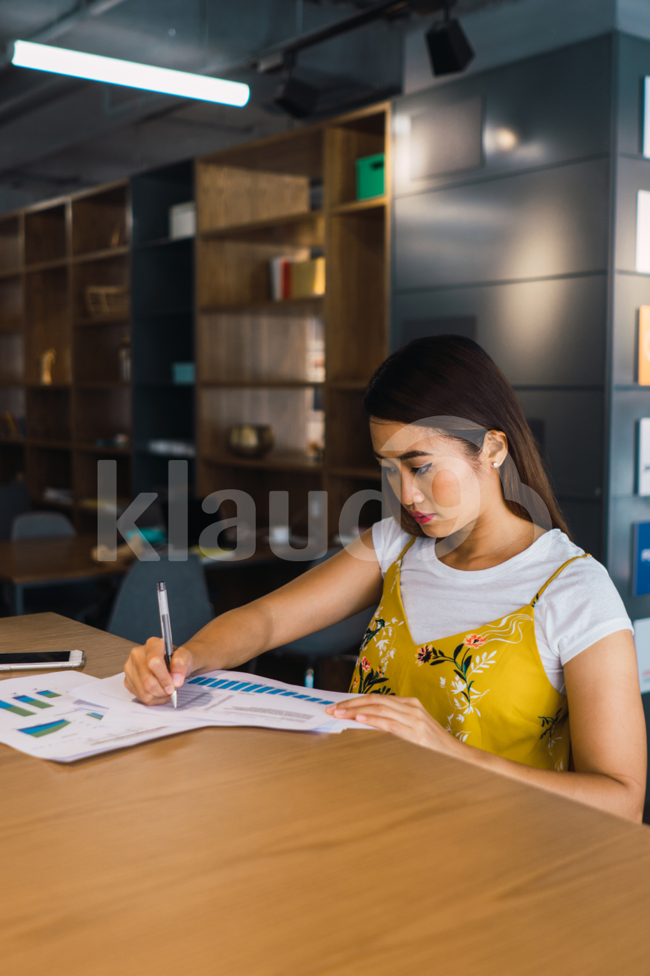 Asian woman sitting in the office