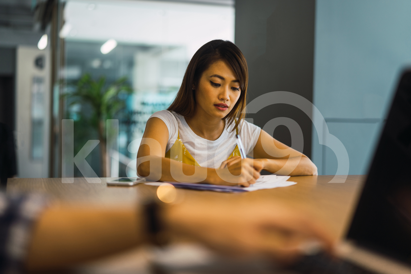 Asian woman sitting in the office