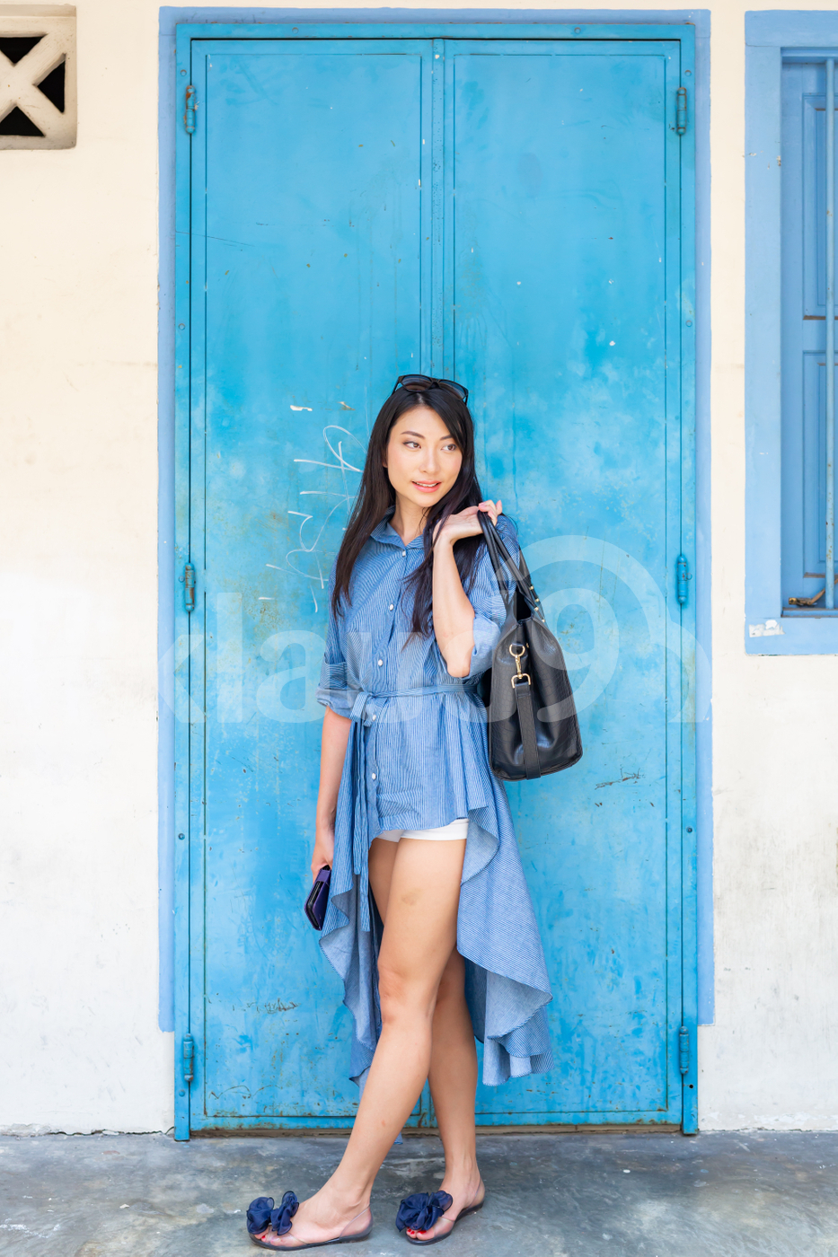 Asian woman standing outdoors