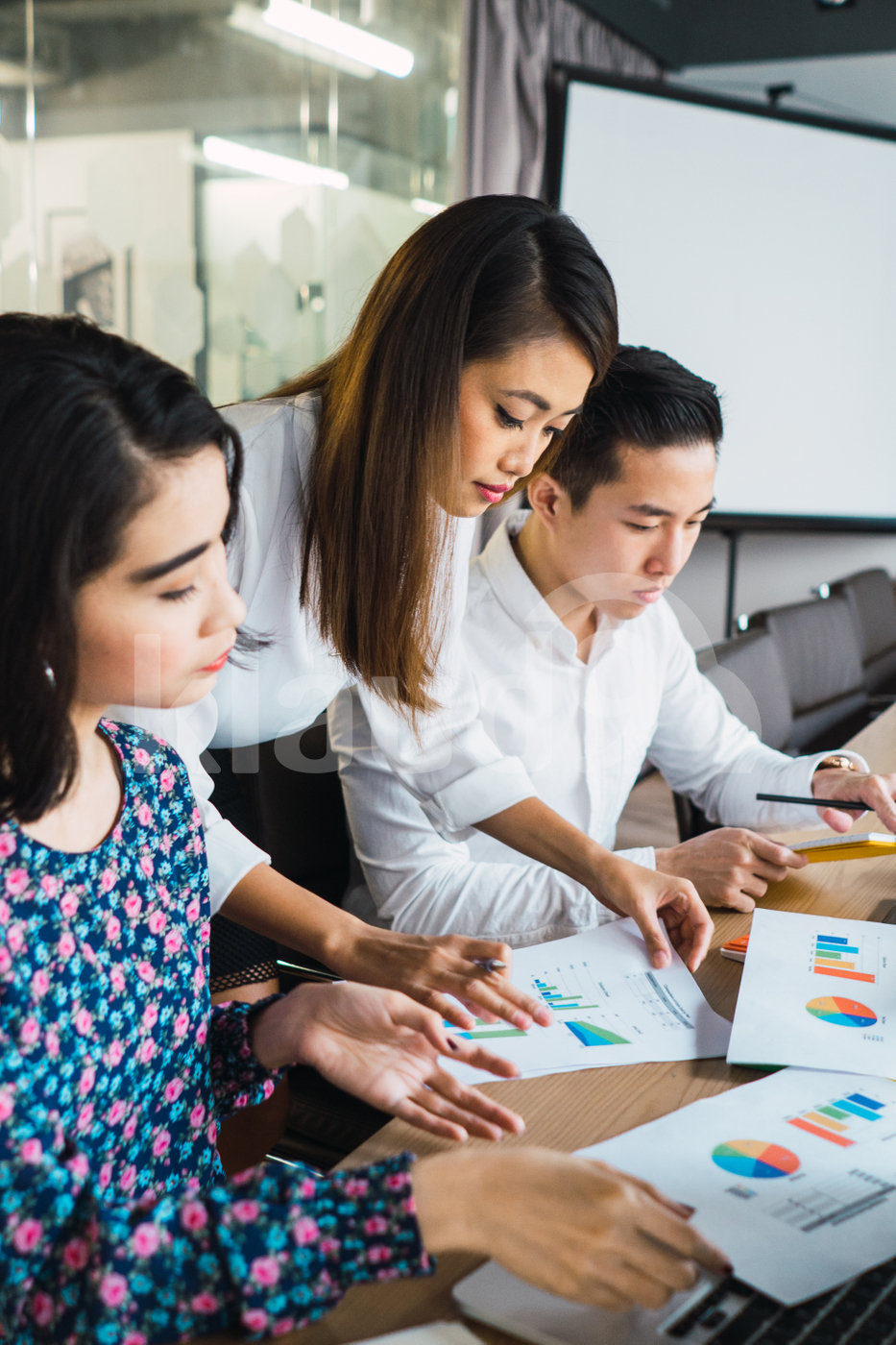 Asian millennials working in a co-working space