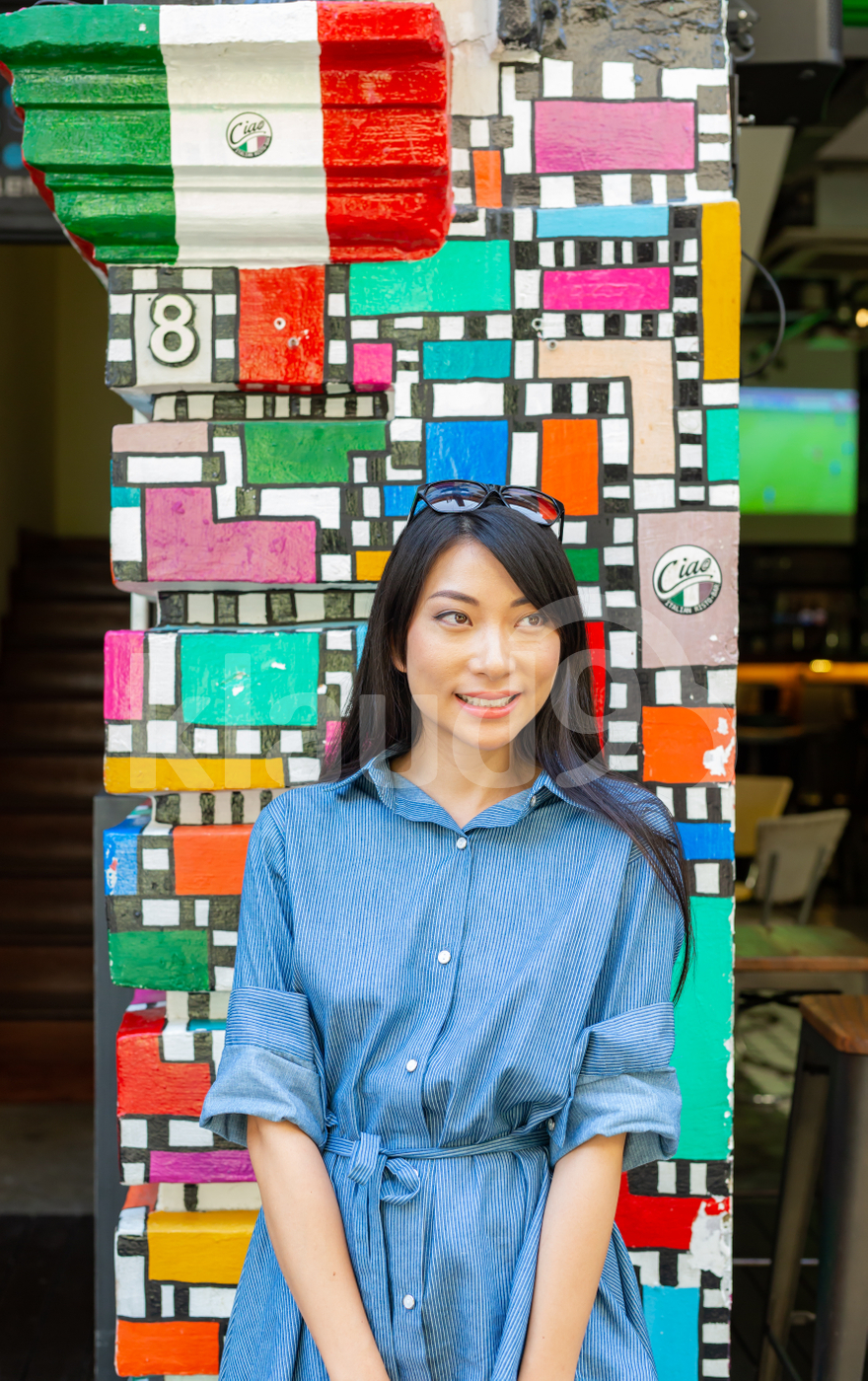 Asian woman standing outdoors