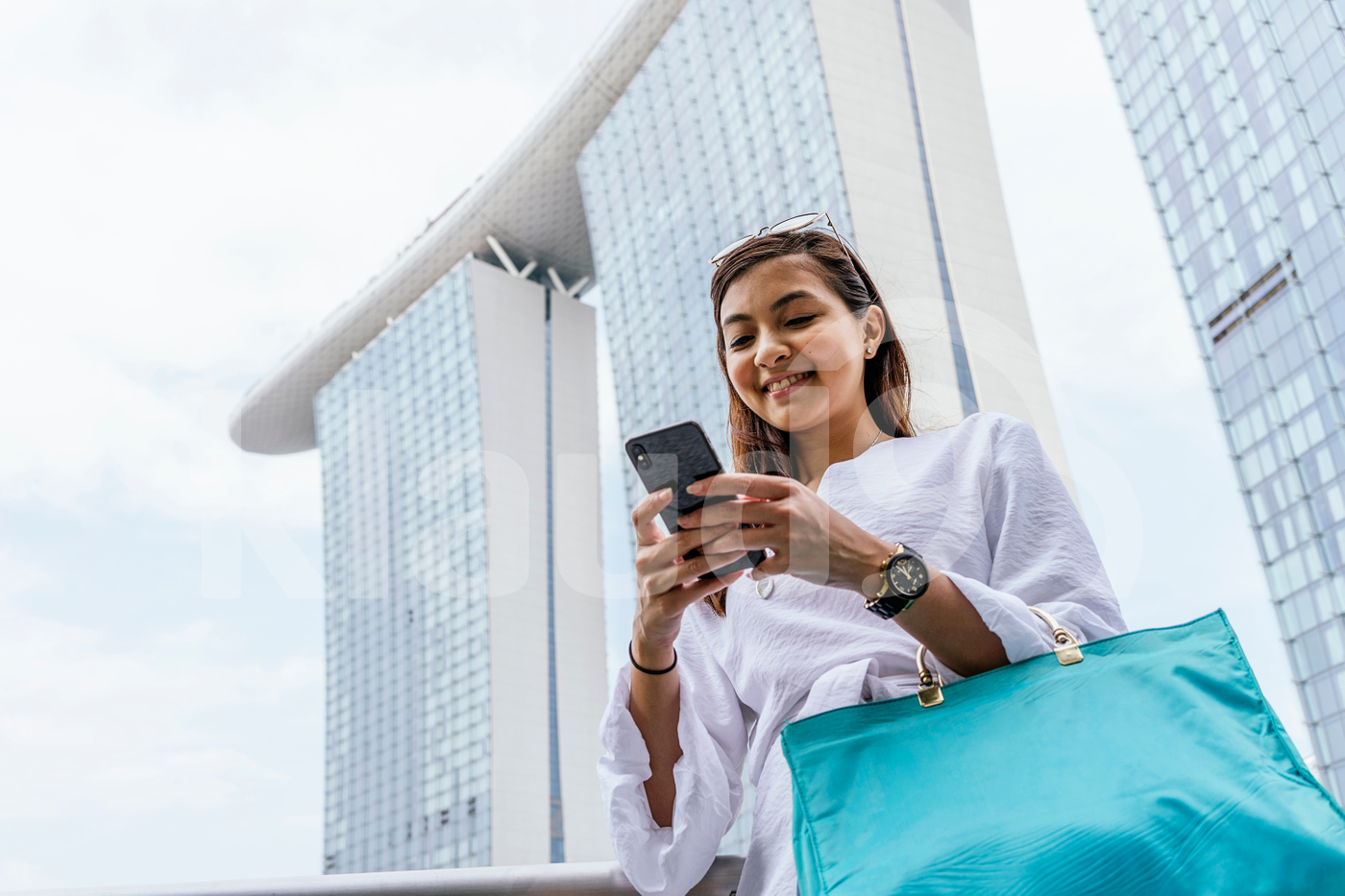 Woman standing using mobile