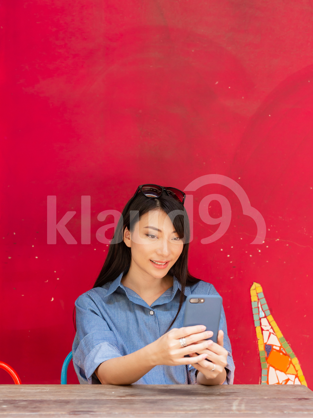 Young Asian woman looking at mobile