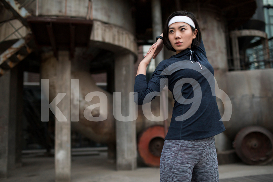 Young Chinese woman exercising outdoors