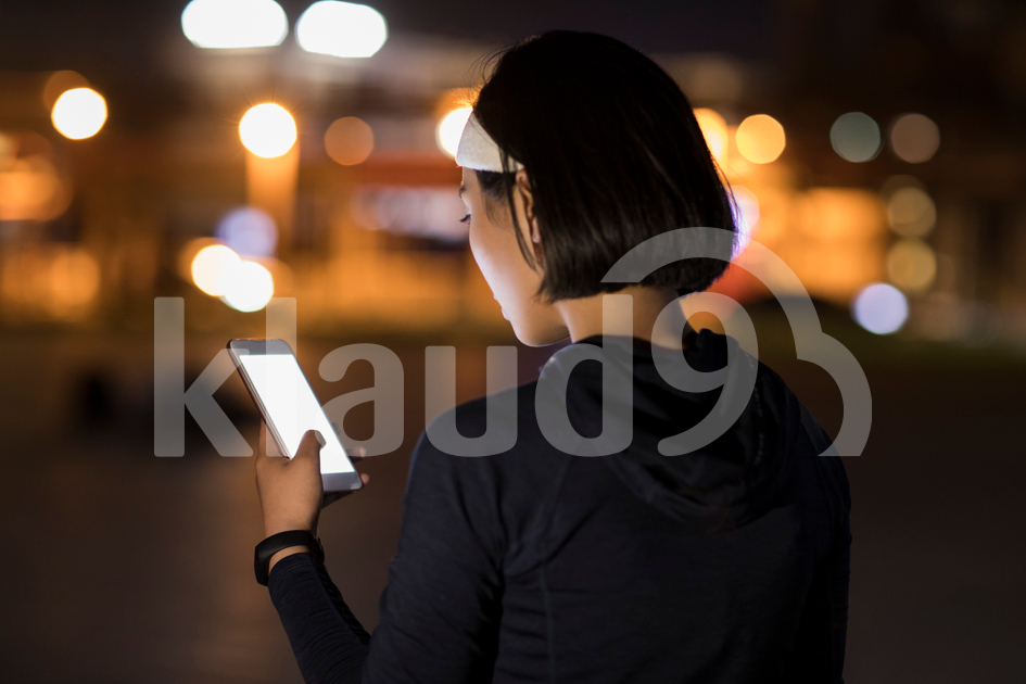 Young Chinese woman using smart phone