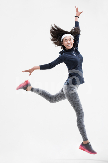Young Chinese woman jumping