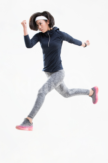 Young Chinese woman jumping