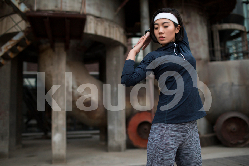 Young Chinese woman exercising outdoors
