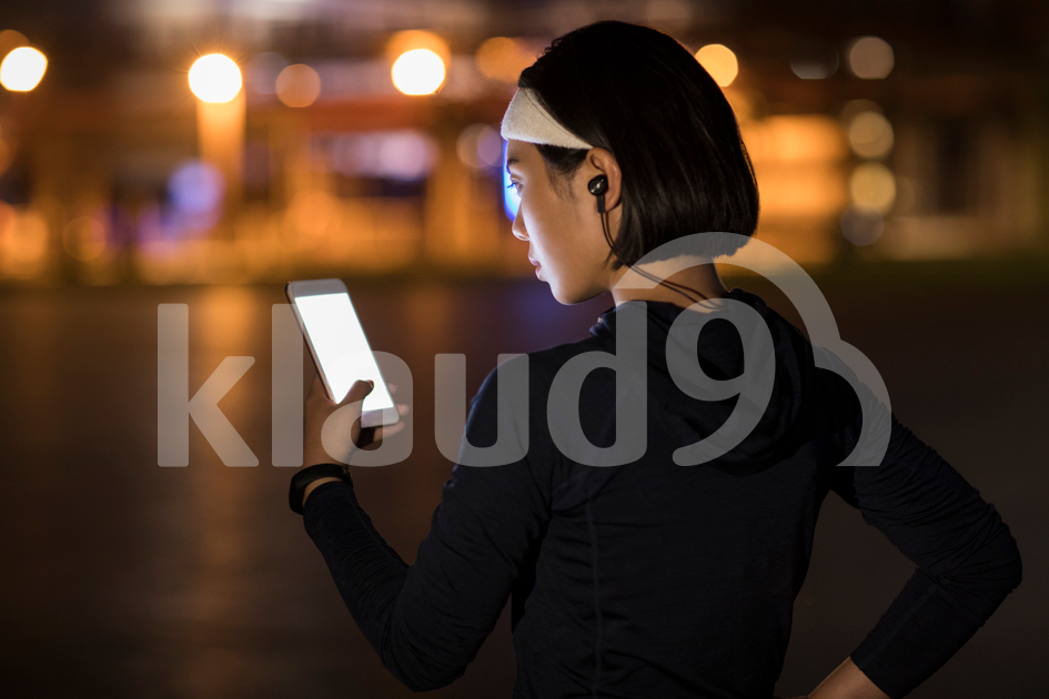 Young Chinese woman using smart phone