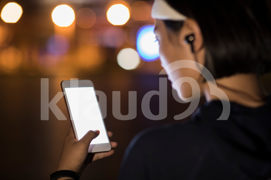 Young Chinese woman using smart phone