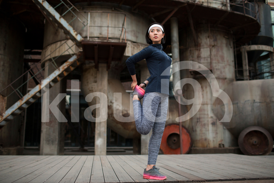 Young Chinese woman exercising outdoors