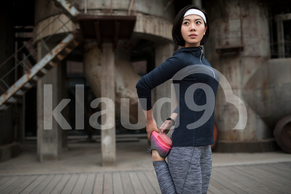 Young Chinese woman exercising outdoors