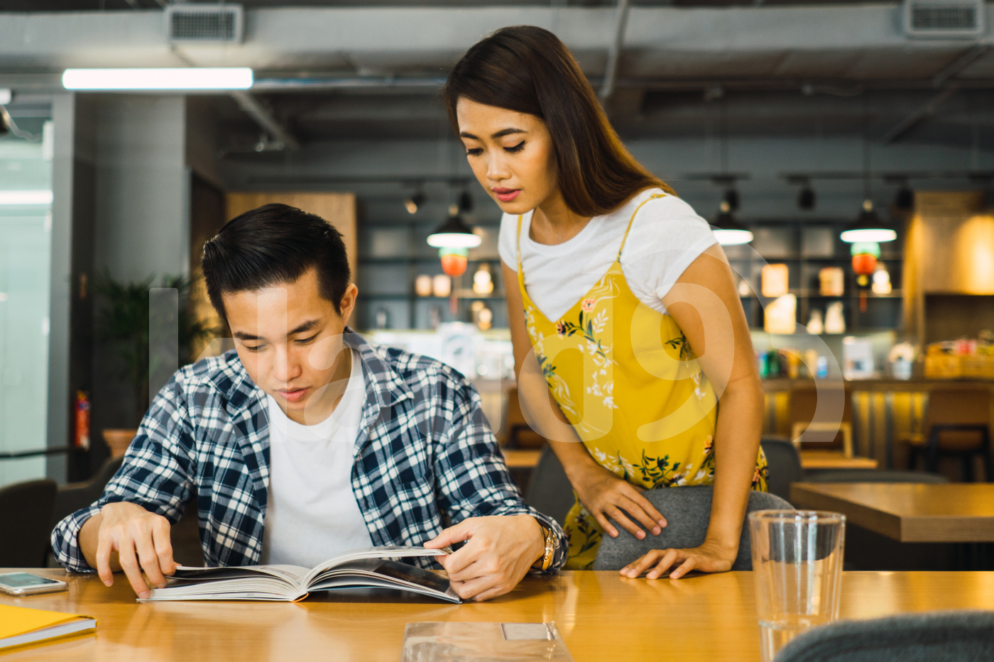 Asian man and Asian woman working in a co-working space