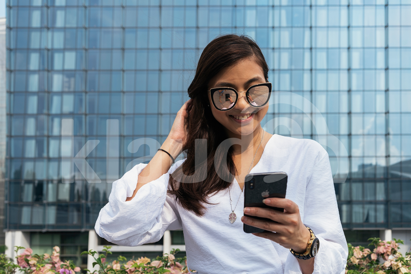 Portrait of young beautiful woman using smartphone